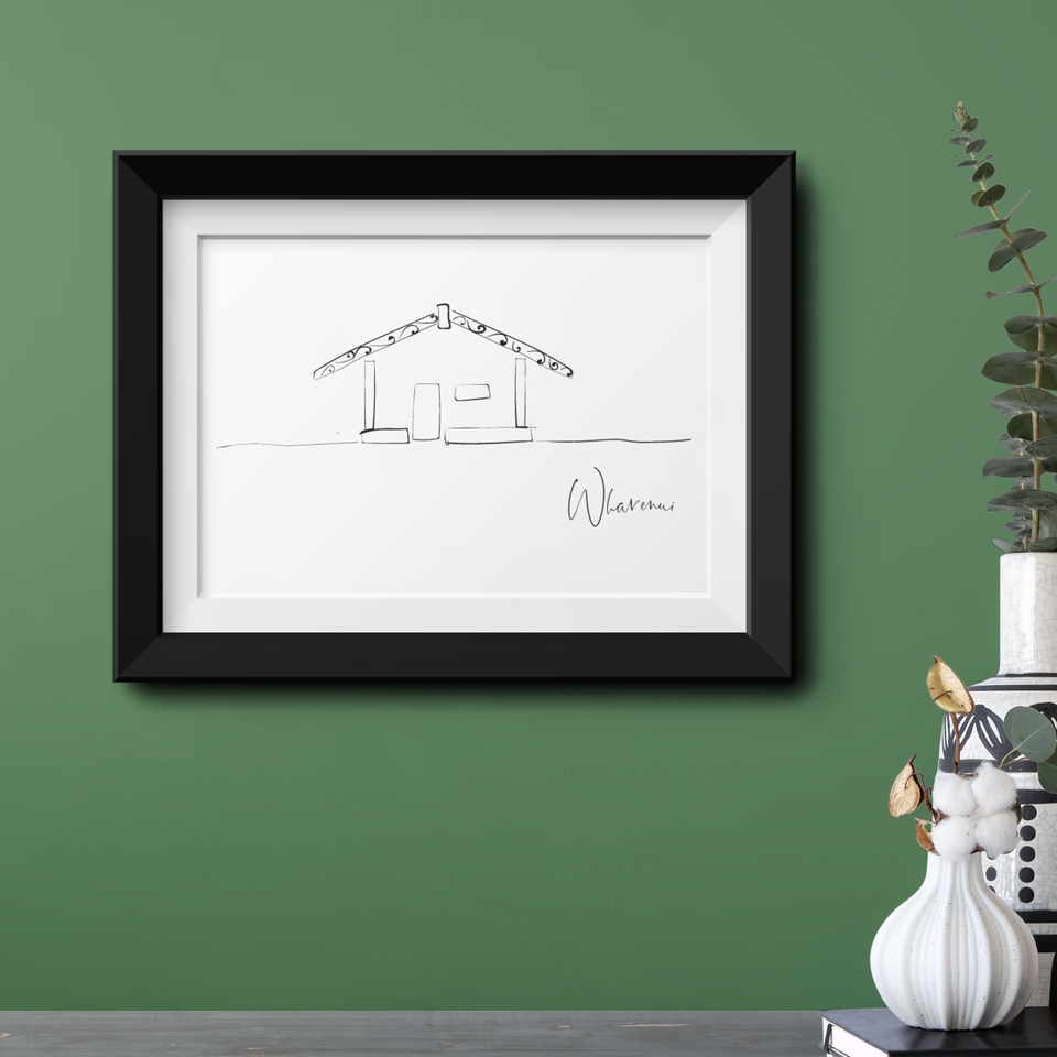 Minimalist Māori-inspired line art print of a traditional wharenui in a black frame, styled against a muted green wall with modern natural décor and eucalyptus accents.