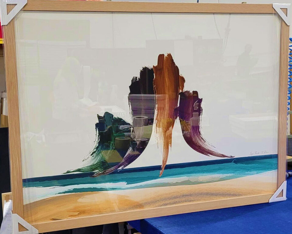 Abstract art print of Te Piha, Lion Rock in West Coast, New Zealand in wood frame by Willa Black Prints nz